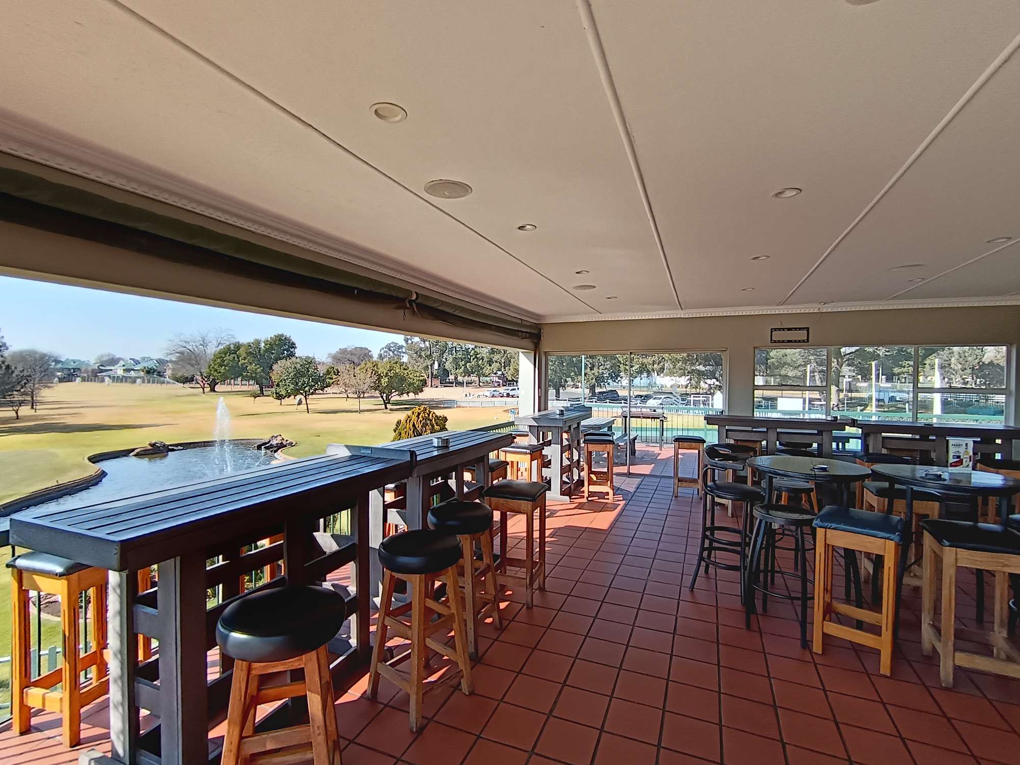 The clubhouse terrace looking over the course and lake at The Lake Club Benoni